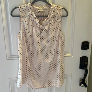 Cream and black sleeveless blouse